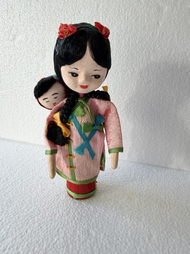 Bambola vintage con pioli